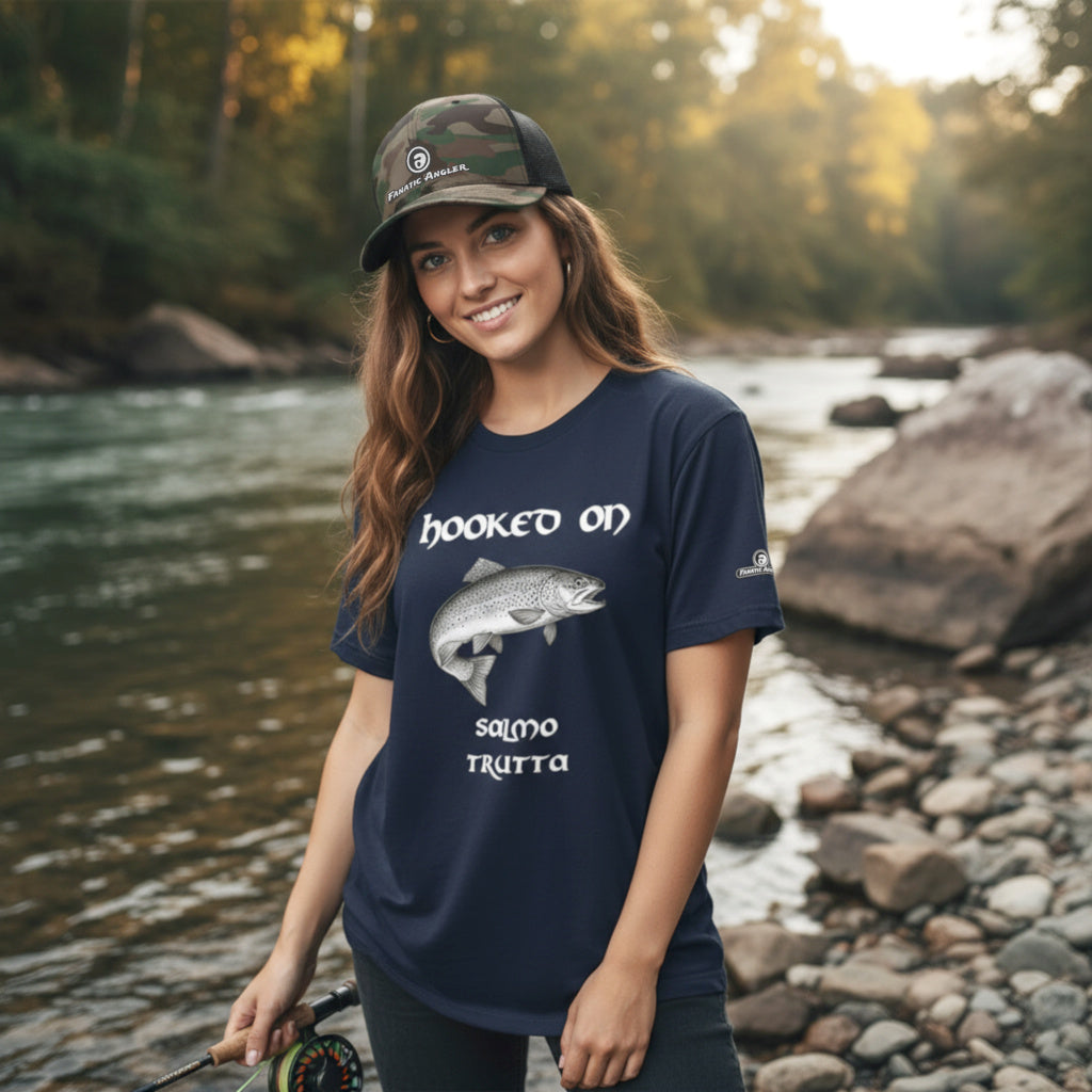 Hooked on Salmo trutta (brown trout) fishing t-shirt – model Lena wearing the premium Indeep Blue (navy) edition with branding detail
