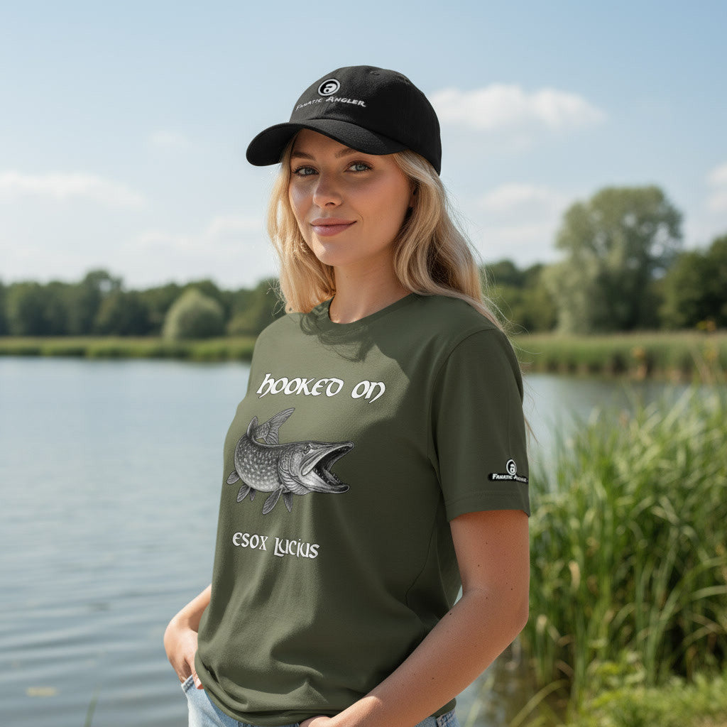 Hooked on Esox lucius (northern pike) fishing t-shirt – model Hailey wearing the premium Predator Green (military green) edition with branding detail