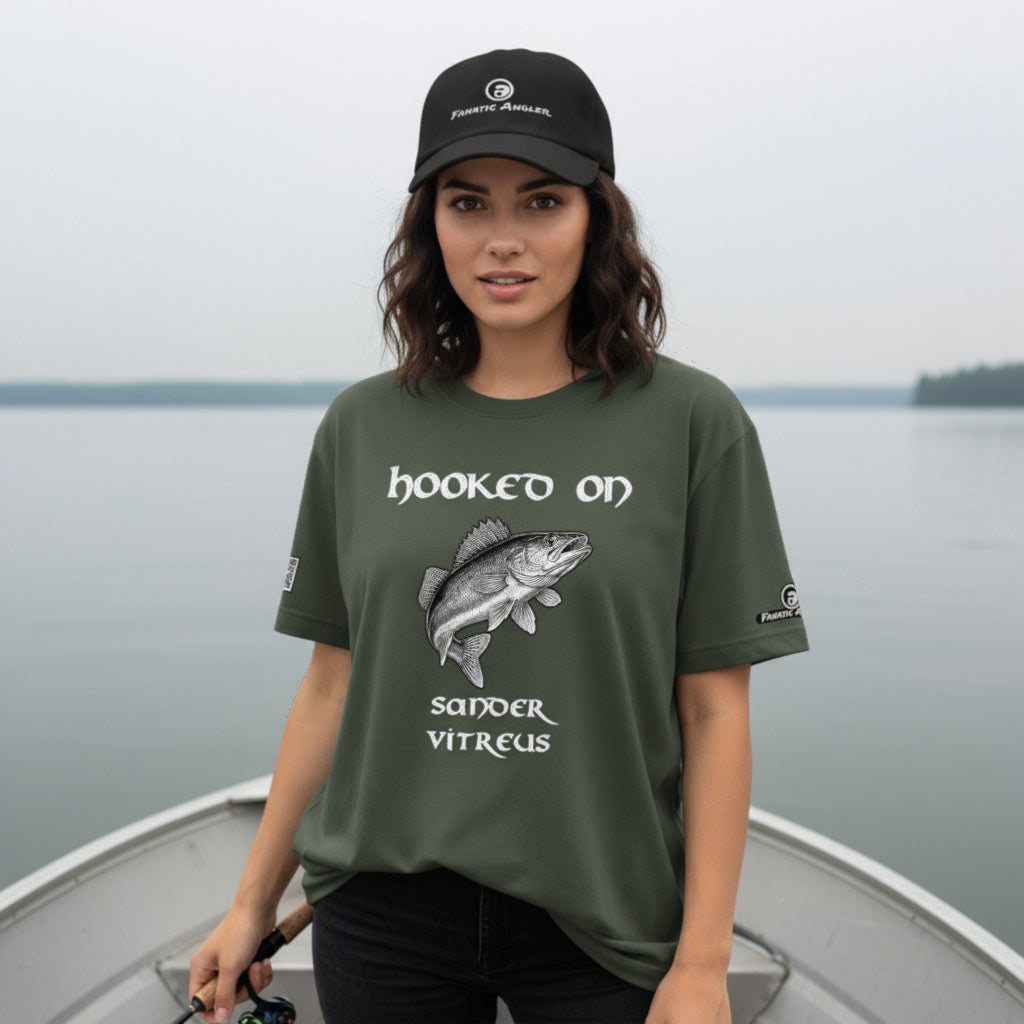 Hooked on Sander vitreus (walleye) fishing t-shirt – model Elise wearing the premium Predator Green (military green) edition with branding detail